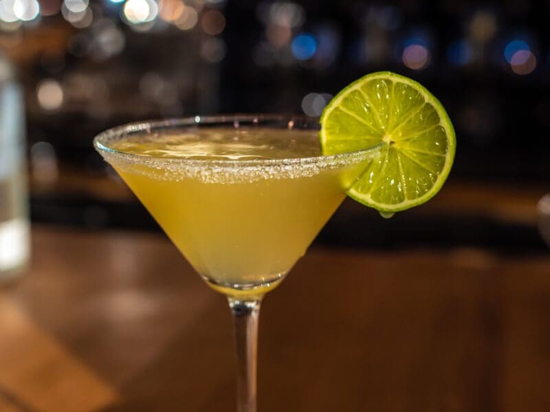 Closeup shot of a glass of Margarita cocktail with lime
